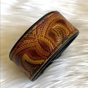 Leather bracelet with snap closure.